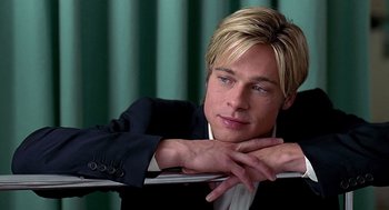 Movie still from “Meet Joe Black” (1998), directed by Martin Brest – A man in a suit leaning against a wall; Close Up shot, High angle