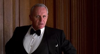 Movie still from “Meet Joe Black” (1998), directed by Martin Brest – An older man wearing a tuxedo and a bow tie; Close Up shot, Low angle