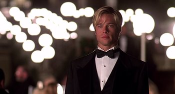 Movie still from “Meet Joe Black” (1998), directed by Martin Brest – A man in a tuxedo standing in front of lights; Close Up shot, Low angle