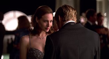 Movie still from “Meet Joe Black” (1998), directed by Martin Brest – A man and a woman standing next to each other; Close Up shot, Over the shoulder angle
