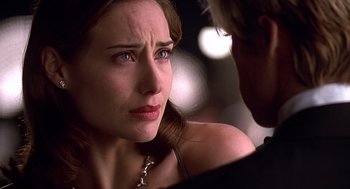 Movie still from “Meet Joe Black” (1998), directed by Martin Brest – A person looking at another person; Close Up shot, Over the shoulder angle