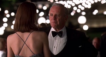 Movie still from “Meet Joe Black” (1998), directed by Martin Brest – A man and a woman in formal wear at a party; Close Up shot, Over the shoulder angle