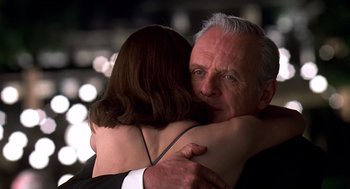 Movie still from “Meet Joe Black” (1998), directed by Martin Brest – A man and a woman hugging each other; Close Up shot, Over the shoulder angle
