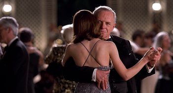 Movie still from “Meet Joe Black” (1998), directed by Martin Brest – An older man and a younger woman dancing together; Close Up shot, Over the shoulder angle