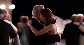 Movie still from “Meet Joe Black” (1998), directed by Martin Brest – A man and a woman dancing together in a ballroom; Medium shot, Low angle