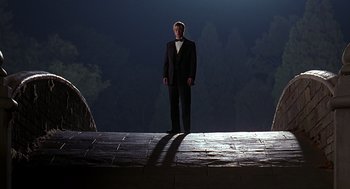 Movie still from “Meet Joe Black” (1998), directed by Martin Brest – A man in a tuxedo standing on a platform; Wide shot, Low angle