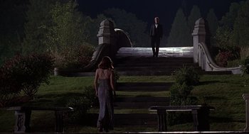 Movie still from “Meet Joe Black” (1998), directed by Martin Brest – A man and a woman walking up steps at night; Wide shot, Low angle