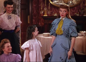 Movie still from “Meet Me in St. Louis” (1944), directed by Vincente Minnelli – A woman and a little girl standing next to each other; Medium shot, Over the shoulder angle
