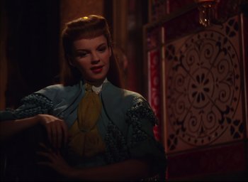 Movie still from “Meet Me in St. Louis” (1944), directed by Vincente Minnelli – A wax statue of a woman in a blue dress; Medium shot, Over the shoulder angle