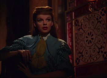 Movie still from “Meet Me in St. Louis” (1944), directed by Vincente Minnelli – A person wearing a dress; Close Up shot, Over the shoulder angle