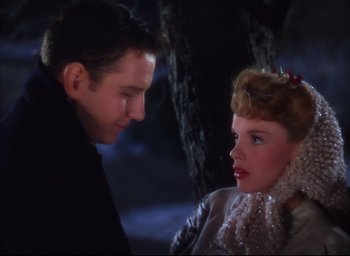 Movie still from “Meet Me in St. Louis” (1944), directed by Vincente Minnelli – A man and a woman are looking at one another; Close Up shot, High angle