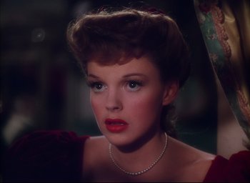 Movie still from “Meet Me in St. Louis” (1944), directed by Vincente Minnelli – A person wearing a necklace; Close Up shot, High angle