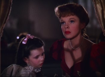 Movie still from “Meet Me in St. Louis” (1944), directed by Vincente Minnelli – A woman and a little girl looking at each other; Close Up shot, Low angle