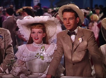 Movie still from “Meet Me in St. Louis” (1944), directed by Vincente Minnelli – A man and a woman dressed up for a costume party; Medium shot, Low angle