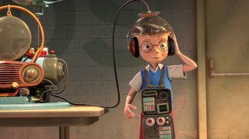 Movie still from “Meet the Robinsons” (2007), directed by Stephen J. Anderson – An animated character wearing headphones and holding a cell phone in one hand; Medium shot, High angle