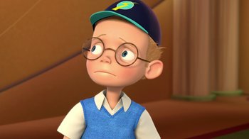 Movie still from “Meet the Robinsons” (2007), directed by Stephen J. Anderson – A cartoon of a boy with glasses and a hat; Close Up shot, Low angle