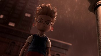 Movie still from “Meet the Robinsons” (2007), directed by Stephen J. Anderson – A boy with glasses is standing in the rain; Medium shot, Low angle