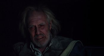Movie still from “Melvin and Howard” (1980), directed by Jonathan Demme – An old man with long white hair and a beard; Close Up shot, Low angle