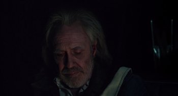 Movie still from “Melvin and Howard” (1980), directed by Jonathan Demme – An old man with long hair and a white beard; Close Up shot, Low angle