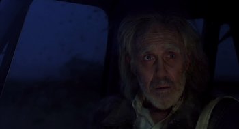 Movie still from “Melvin and Howard” (1980), directed by Jonathan Demme – An old man with a long white beard sitting in a car at night; Close Up shot, Low angle