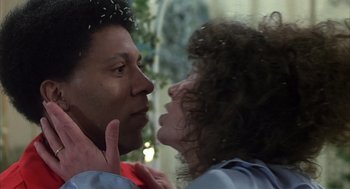 Movie still from “Melvin and Howard” (1980), directed by Jonathan Demme – A man and a woman face to face in front of a window; Close Up shot, Low angle