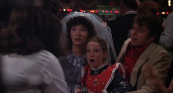 Movie still from “Melvin and Howard” (1980), directed by Jonathan Demme – Two young girls dressed up as a bride and groom; Close Up shot, Over the shoulder angle