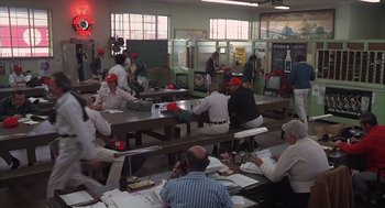 Movie still from “Melvin and Howard” (1980), directed by Jonathan Demme – A group of people sitting at tables in a restaurant; Wide shot, High angle