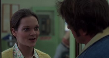 Movie still from “Melvin and Howard” (1980), directed by Jonathan Demme – A woman talking to a young man in a room; Close Up shot, Over the shoulder angle