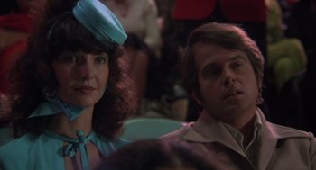 Movie still from “Melvin and Howard” (1980), directed by Jonathan Demme – A man and a woman sitting next to each other; Close Up shot, Over the shoulder angle