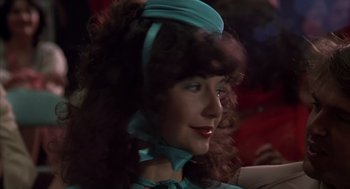 Movie still from “Melvin and Howard” (1980), directed by Jonathan Demme – A person with long hair wearing a hat; Close Up shot, Low angle