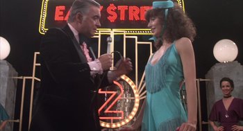 Movie still from “Melvin and Howard” (1980), directed by Jonathan Demme – A man and a woman are talking to each other; Medium shot, Over the shoulder angle
