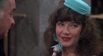 Movie still from “Melvin and Howard” (1980), directed by Jonathan Demme – A person with a microphone; Close Up shot, Over the shoulder angle