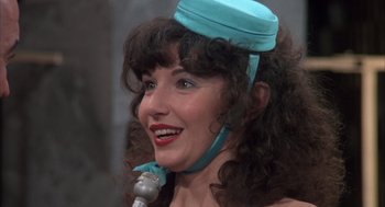 Movie still from “Melvin and Howard” (1980), directed by Jonathan Demme – A person with a microphone; Close Up shot, High angle