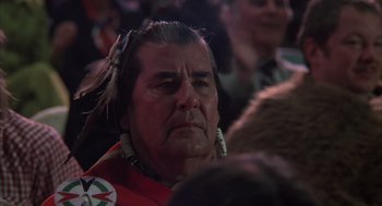 Movie still from “Melvin and Howard” (1980), directed by Jonathan Demme – An older man in a native american outfit; Close Up shot, Over the shoulder angle