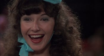 Movie still from “Melvin and Howard” (1980), directed by Jonathan Demme – A person with curly brown hair; Close Up shot, Low angle