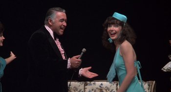 Movie still from “Melvin and Howard” (1980), directed by Jonathan Demme – A man and a woman are talking to each other; Medium shot, High angle