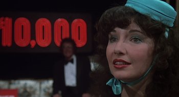 Movie still from “Melvin and Howard” (1980), directed by Jonathan Demme – A person wearing a hat; Close Up shot, Over the shoulder angle