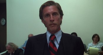Movie still from “Melvin and Howard” (1980), directed by Jonathan Demme – A person wearing a suit and a tie; Close Up shot, Low angle