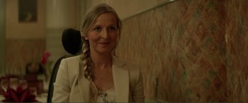 Movie still from “Men & Chicken” (2015), directed by Anders Thomas Jensen – A woman in a white jacket and a long braid; Close Up shot, Over the shoulder angle