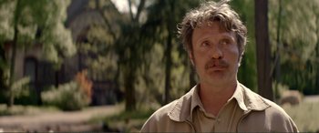 Movie still from “Men & Chicken” (2015), directed by Anders Thomas Jensen – A person wearing a shirt; Close Up shot, Over the shoulder angle