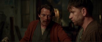 Movie still from “Men & Chicken” (2015), directed by Anders Thomas Jensen – A man in a brown jacket is looking at a man in a red jacket; Close Up shot, Over the shoulder angle