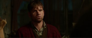 Movie still from “Men & Chicken” (2015), directed by Anders Thomas Jensen – A person wearing a sweater; Close Up shot, Over the shoulder angle