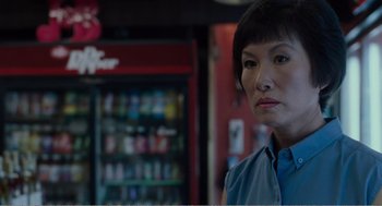 Movie still from “Menace II Society” (1993), directed by Albert Hughes – A woman standing in front of a vending machine; Close Up shot, Over the shoulder angle
