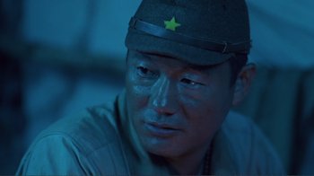 Movie still from “Merry Christmas Mr. Lawrence” (1983), directed by Nagisa Ôshima – A man in a military uniform with a star on his hat; Close Up shot, Low angle