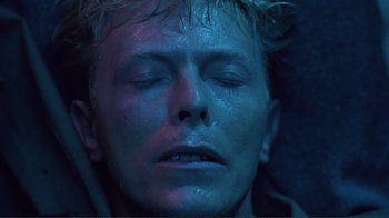 Movie still from “Merry Christmas Mr. Lawrence” (1983), directed by Nagisa Ôshima – A man's face in the dark; Close Up shot, Overhead angle