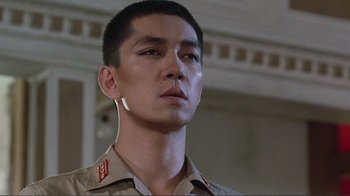 Movie still from “Merry Christmas Mr. Lawrence” (1983), directed by Nagisa Ôshima – A person wearing a military uniform; Close Up shot, Low angle