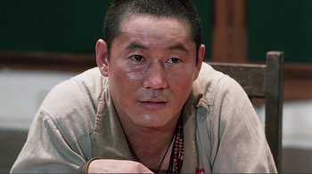 Movie still from “Merry Christmas Mr. Lawrence” (1983), directed by Nagisa Ôshima – A person wearing a shirt; Close Up shot, High angle