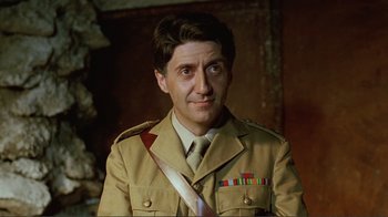 Movie still from “Merry Christmas Mr. Lawrence” (1983), directed by Nagisa Ôshima – A person wearing a uniform; Close Up shot, Low angle