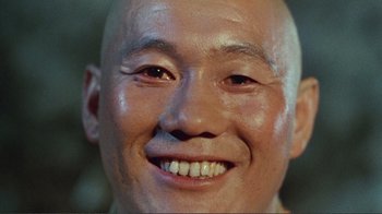 Movie still from “Merry Christmas Mr. Lawrence” (1983), directed by Nagisa Ôshima – A man's head and face; Extreme Close Up shot, Low angle