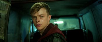 Movie still from “Metallica Through the Never” (2013), directed by Nimród Antal – A person wearing a leather jacket; Close Up shot, Over the shoulder angle